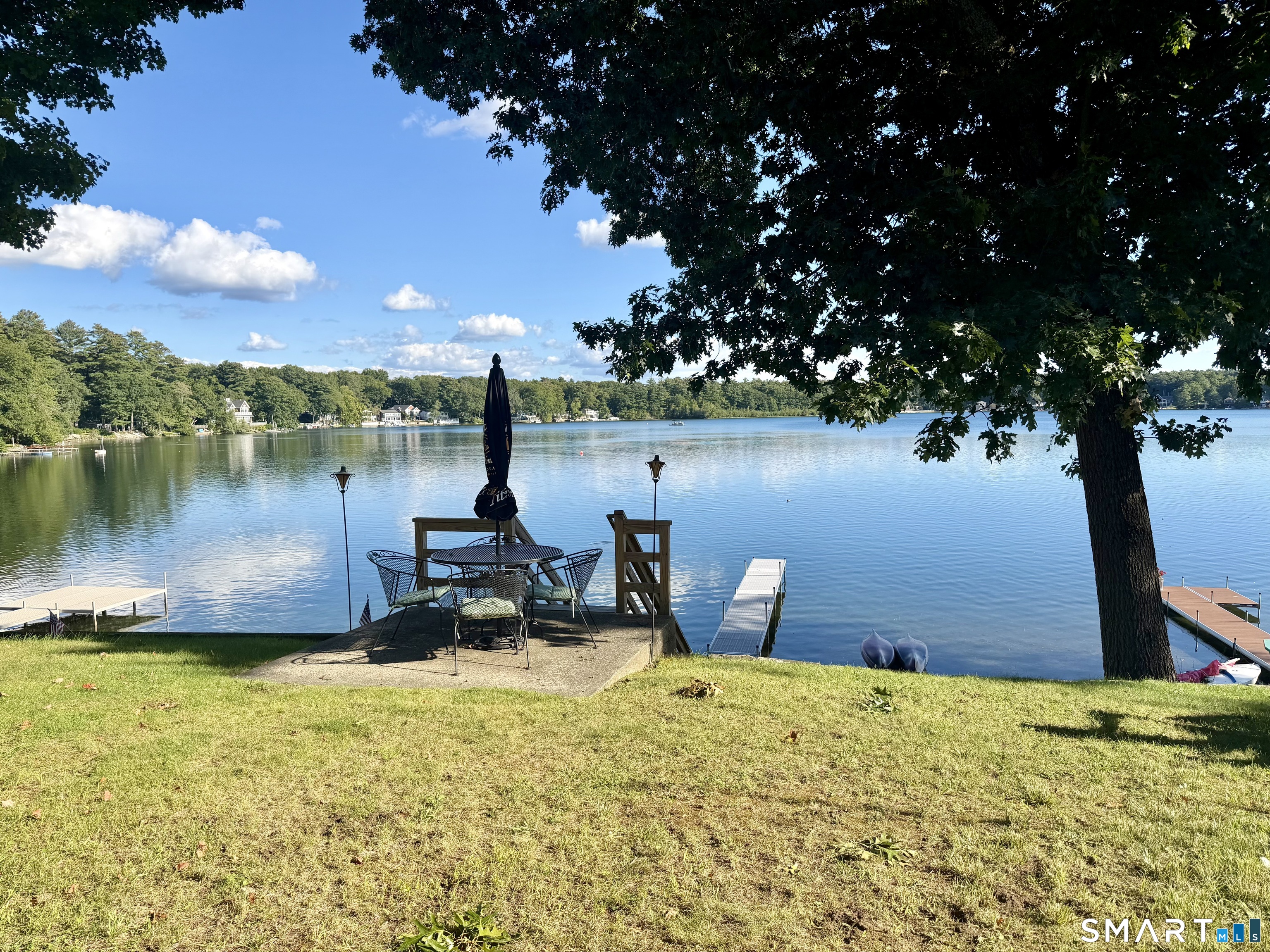 204 Pine Hollow Road Killingly, CT 06241 - Photo 8 of 20 So special. A beautiful level waterside yard, private dock and wide-open views across Alexander's Lake create an exceptional setting for family gatherings and peaceful evenings by the water. This is more than a home it is the lake lifestyle.