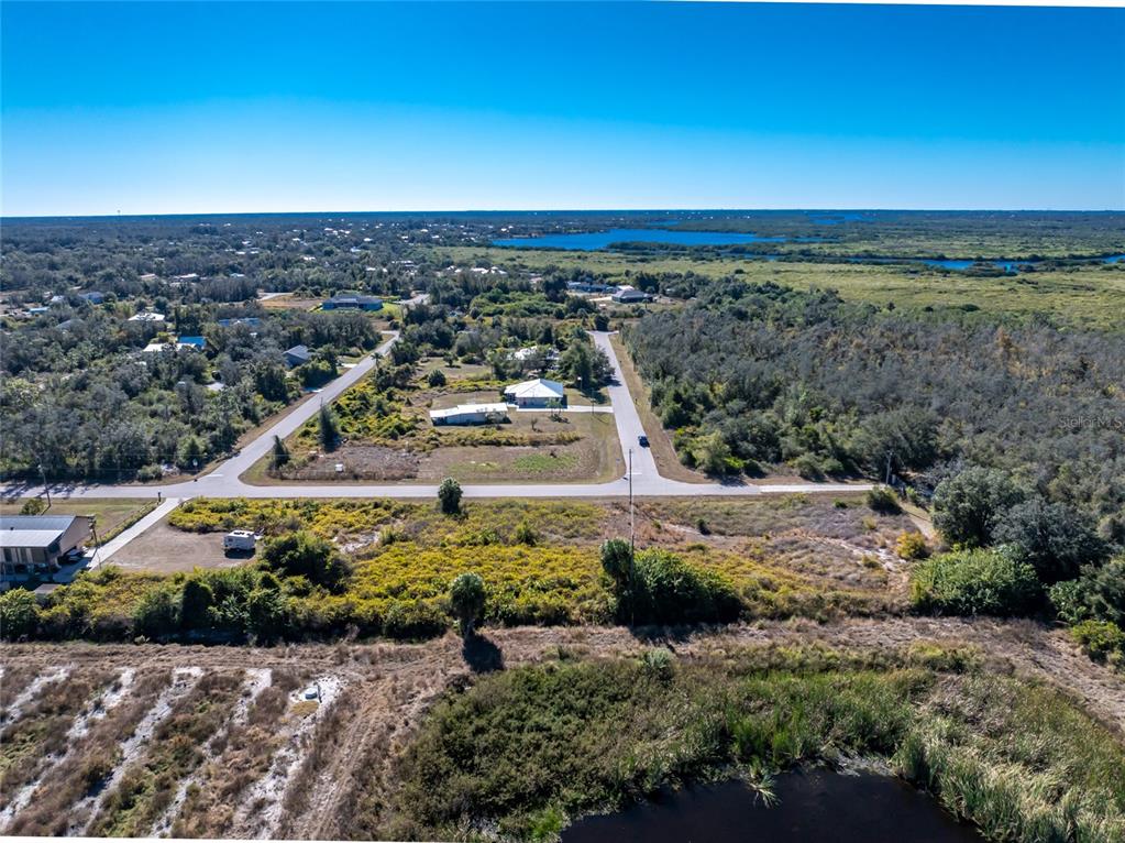 29028 Boyce Road Punta Gorda, FL 33982 - Photo 5 of 12 an aerial view of residential houses with outdoor space