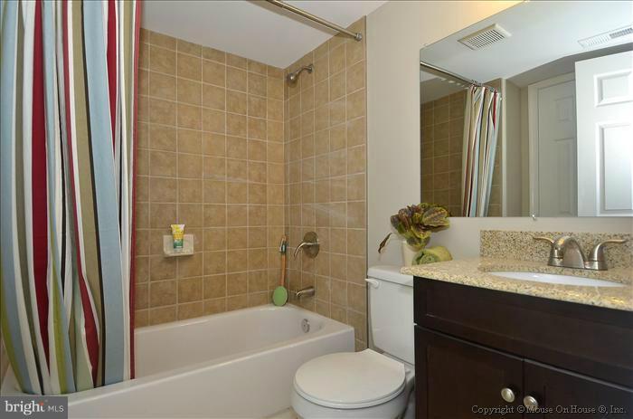 10302 Ridgemoor Drive Silver Spring, MD 20901 - Photo 11 of 16 a bathroom with a sink a toilet and shower