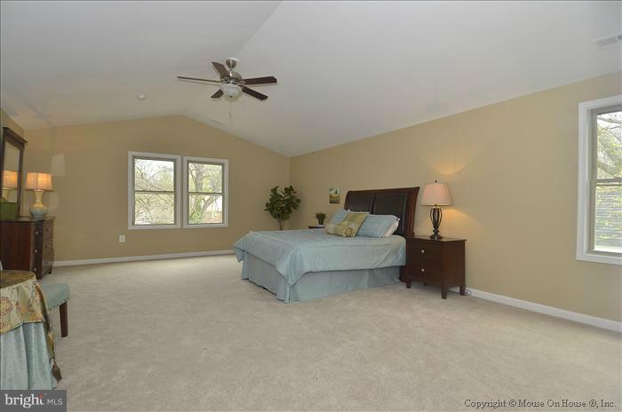 10302 Ridgemoor Drive Silver Spring, MD 20901 - Photo 6 of 16 a bedroom with a bed and a window