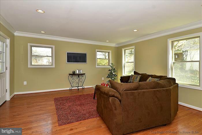10302 Ridgemoor Drive Silver Spring, MD 20901 - Photo 7 of 16 a living room with furniture and a flat screen tv