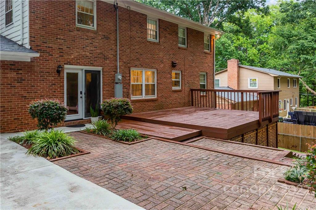 6620 Fairlawn Road Charlotte, NC 28215 - Photo 11 of 43 a view of backyard with deck and outdoor seating