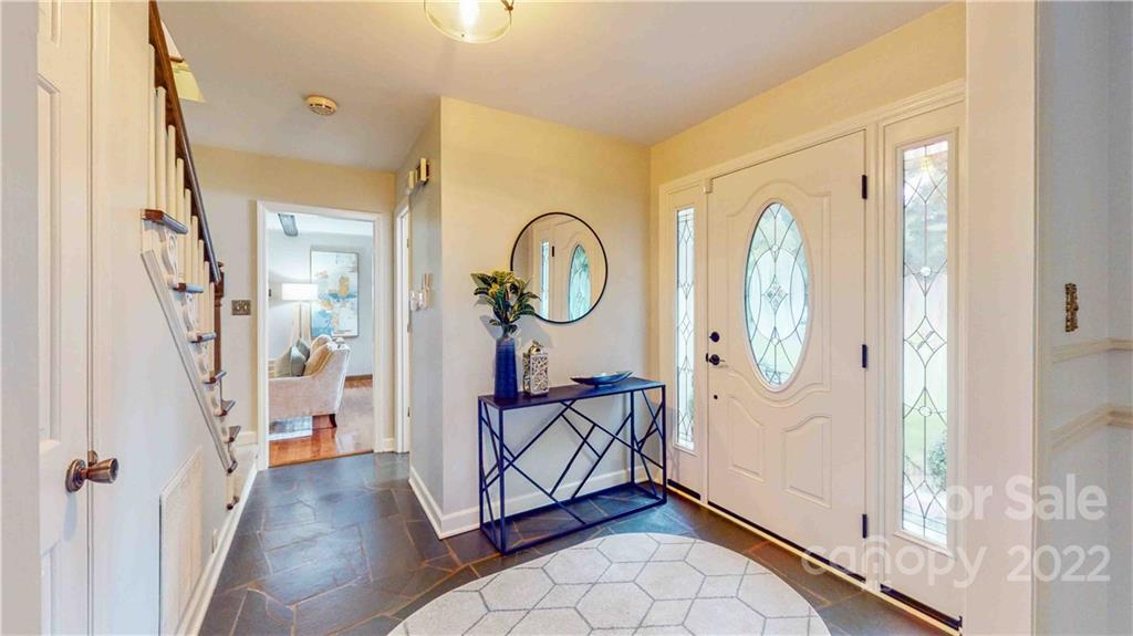 6620 Fairlawn Road Charlotte, NC 28215 - Photo 13 of 43 a view of a hallway with entryway windows and a livingroom