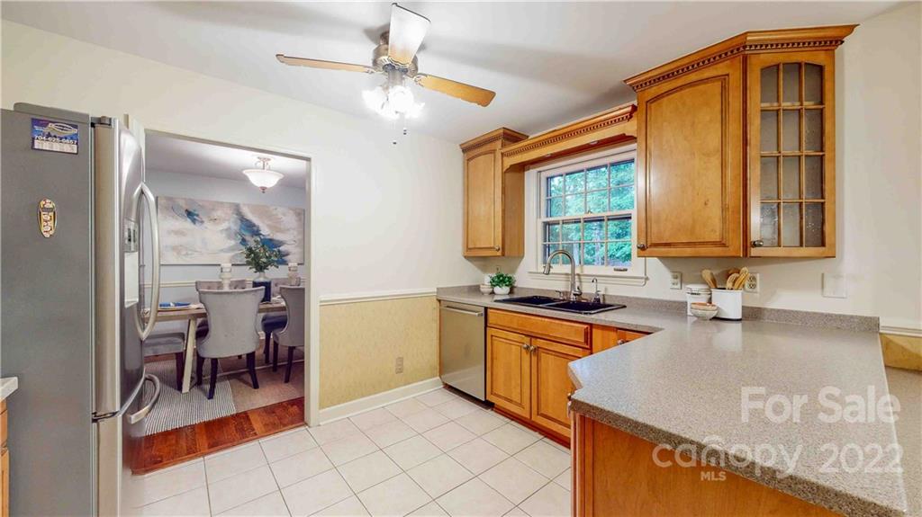 6620 Fairlawn Road Charlotte, NC 28215 - Photo 20 of 43 a kitchen with granite countertop a sink and cabinets