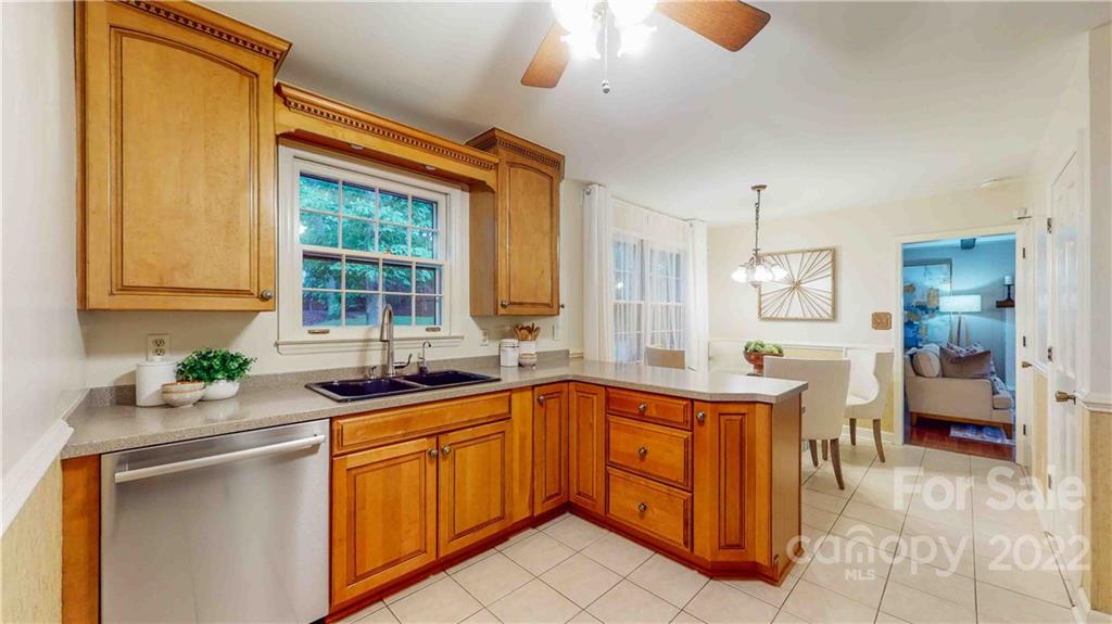 6620 Fairlawn Road Charlotte, NC 28215 - Photo 21 of 43 a kitchen with a sink and cabinets