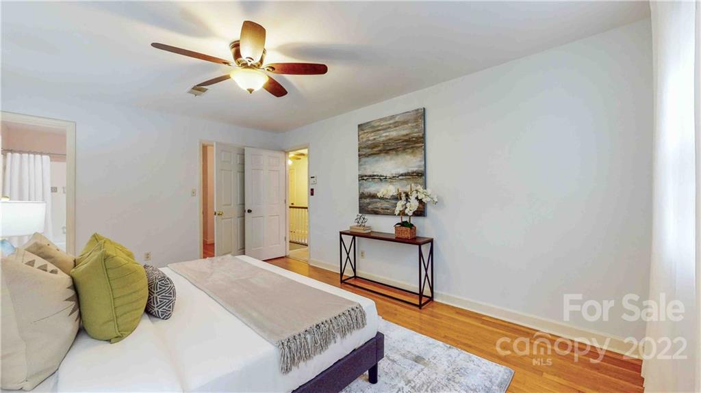 6620 Fairlawn Road Charlotte, NC 28215 - Photo 28 of 43 a bedroom with a bed and a table
