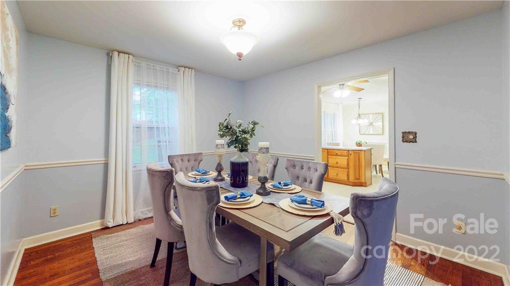 6620 Fairlawn Road Charlotte, NC 28215 - Photo 29 of 43 a view of a dining room with furniture and wooden floor