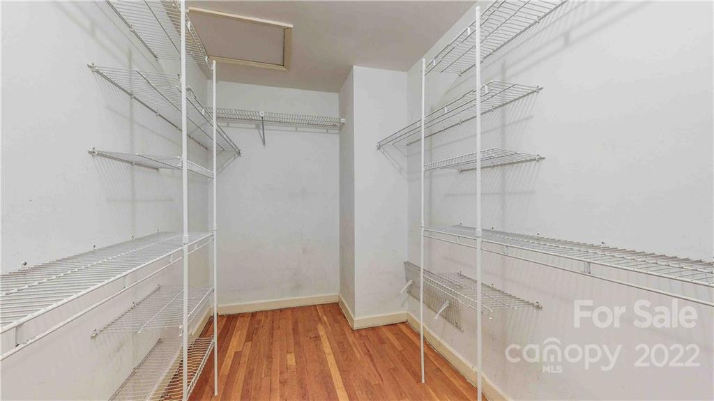 6620 Fairlawn Road Charlotte, NC 28215 - Photo 30 of 43 a view of walk in closet with empty racks