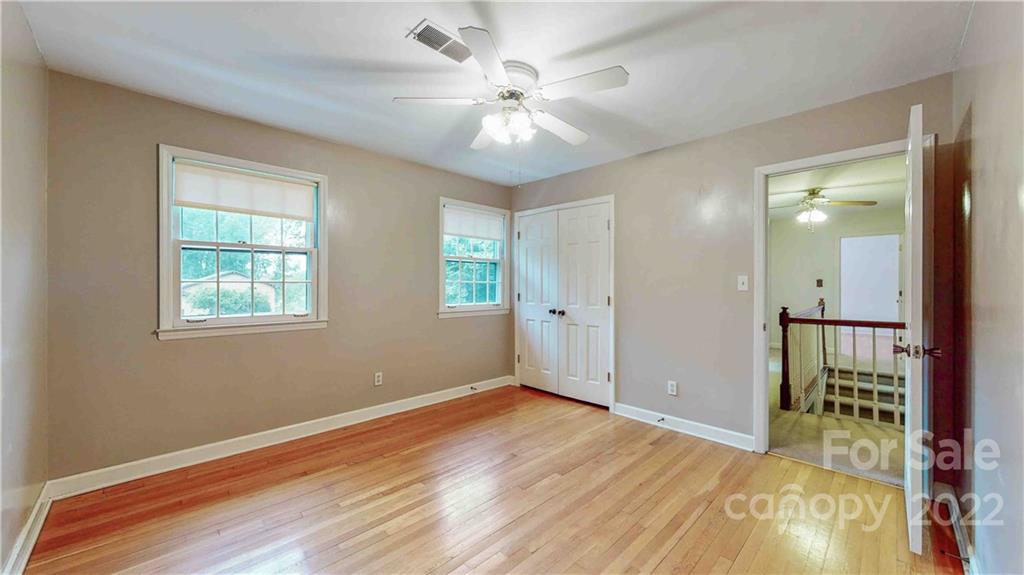 6620 Fairlawn Road Charlotte, NC 28215 - Photo 31 of 43 a view of an empty room with window and wooden floor