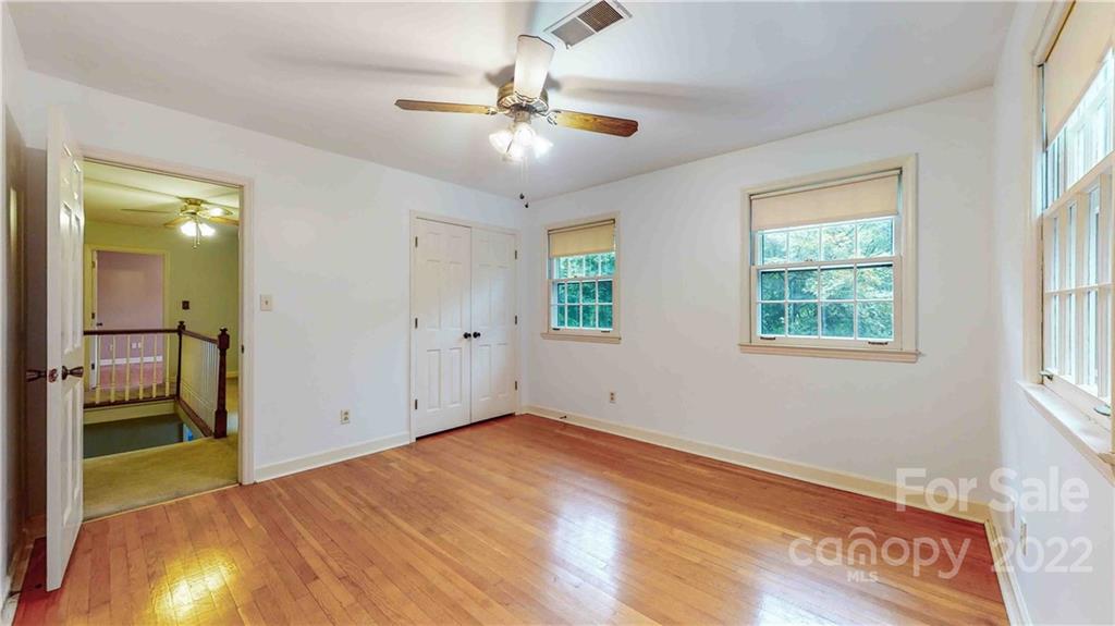6620 Fairlawn Road Charlotte, NC 28215 - Photo 32 of 43 wooden floor in an empty room with a window