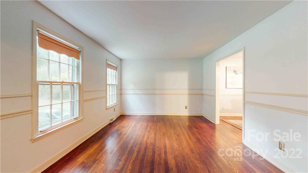 6620 Fairlawn Road Charlotte, NC 28215 - Photo 33 of 43 an empty room with wooden floor and windows