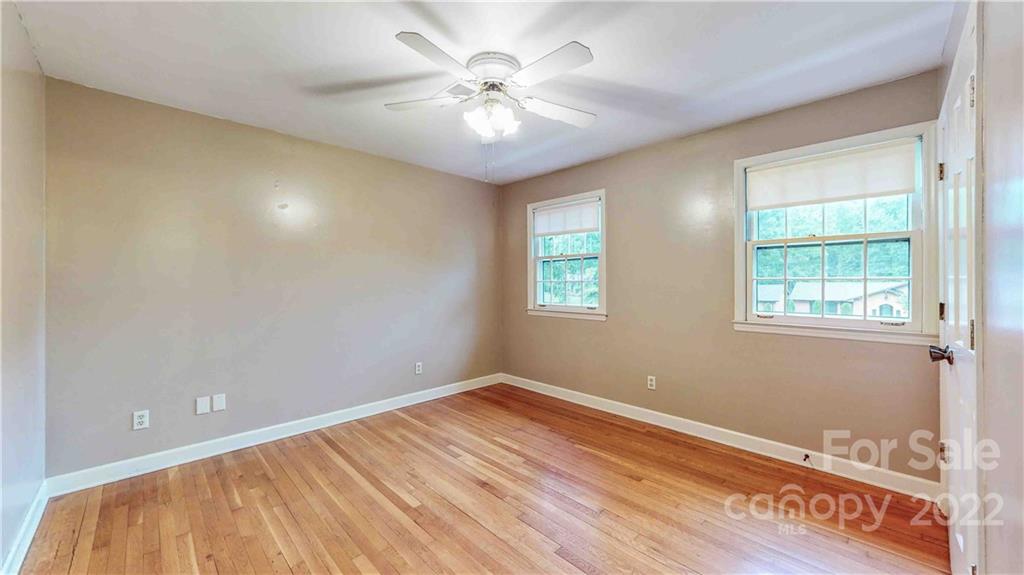 6620 Fairlawn Road Charlotte, NC 28215 - Photo 34 of 43 wooden floor in an empty room with a window