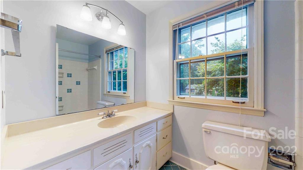 6620 Fairlawn Road Charlotte, NC 28215 - Photo 38 of 43 a bathroom with a sink and a window