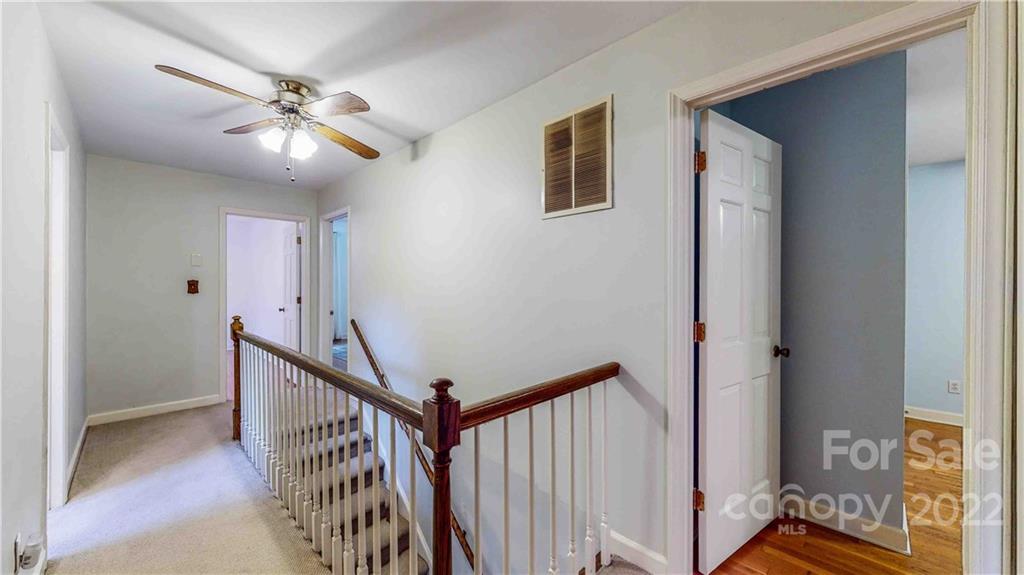 6620 Fairlawn Road Charlotte, NC 28215 - Photo 40 of 43 a view of a hallway with a livingroom and stairs