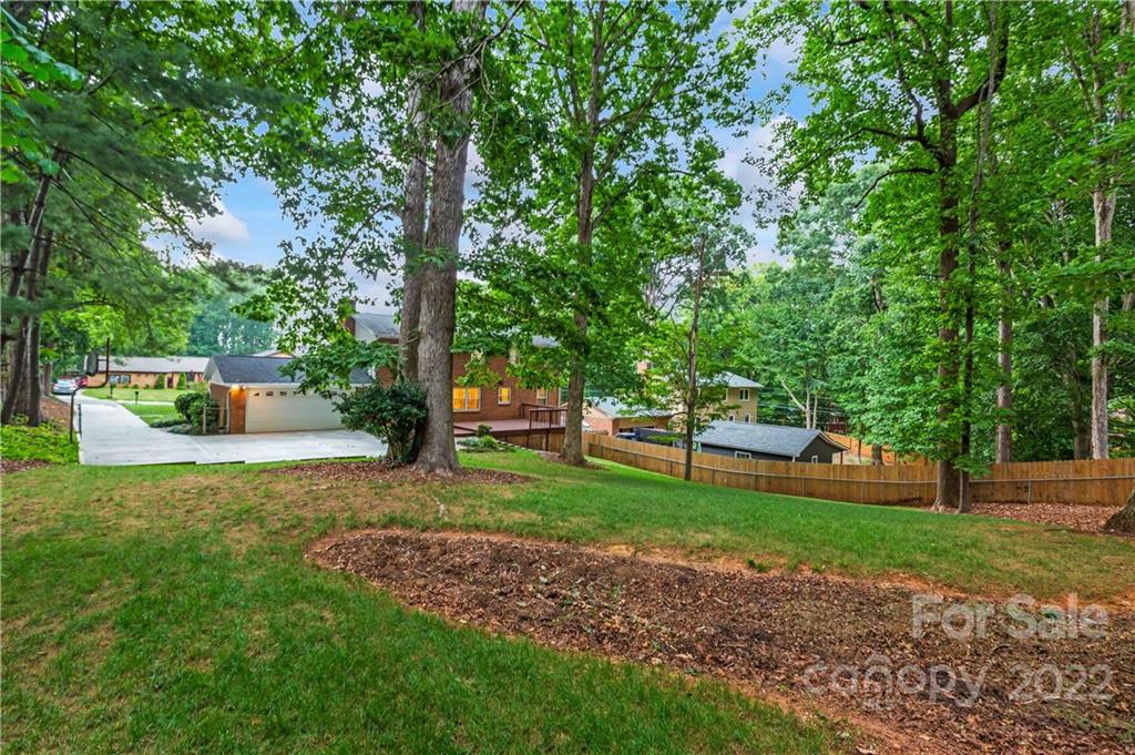 6620 Fairlawn Road Charlotte, NC 28215 - Photo 5 of 43 a view of a park with large trees