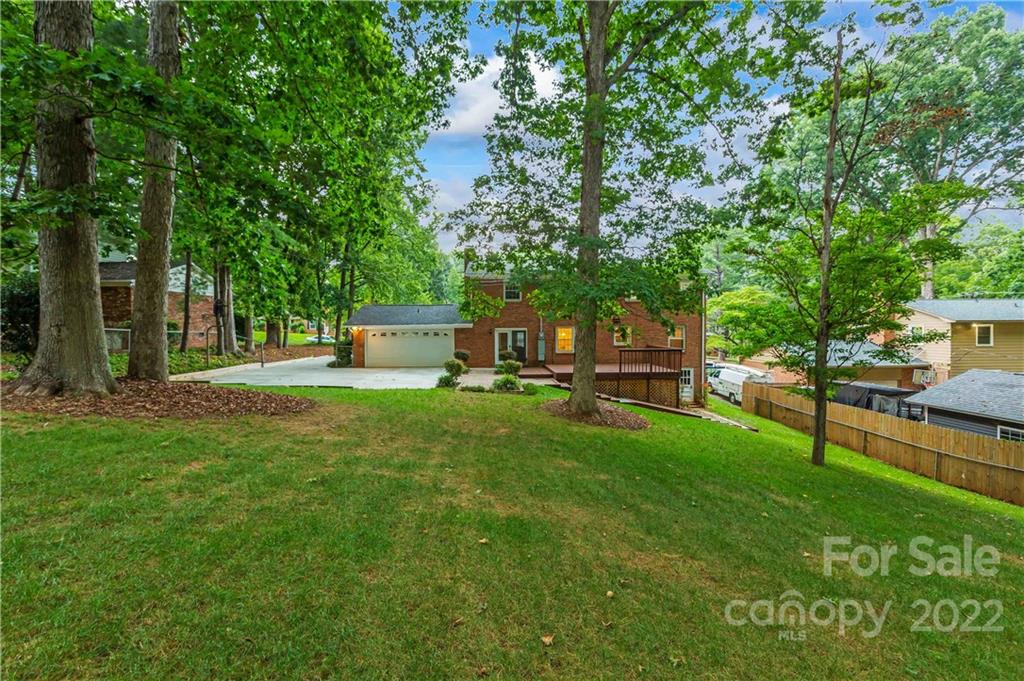 6620 Fairlawn Road Charlotte, NC 28215 - Photo 6 of 43 a house view with a sitting space and garden