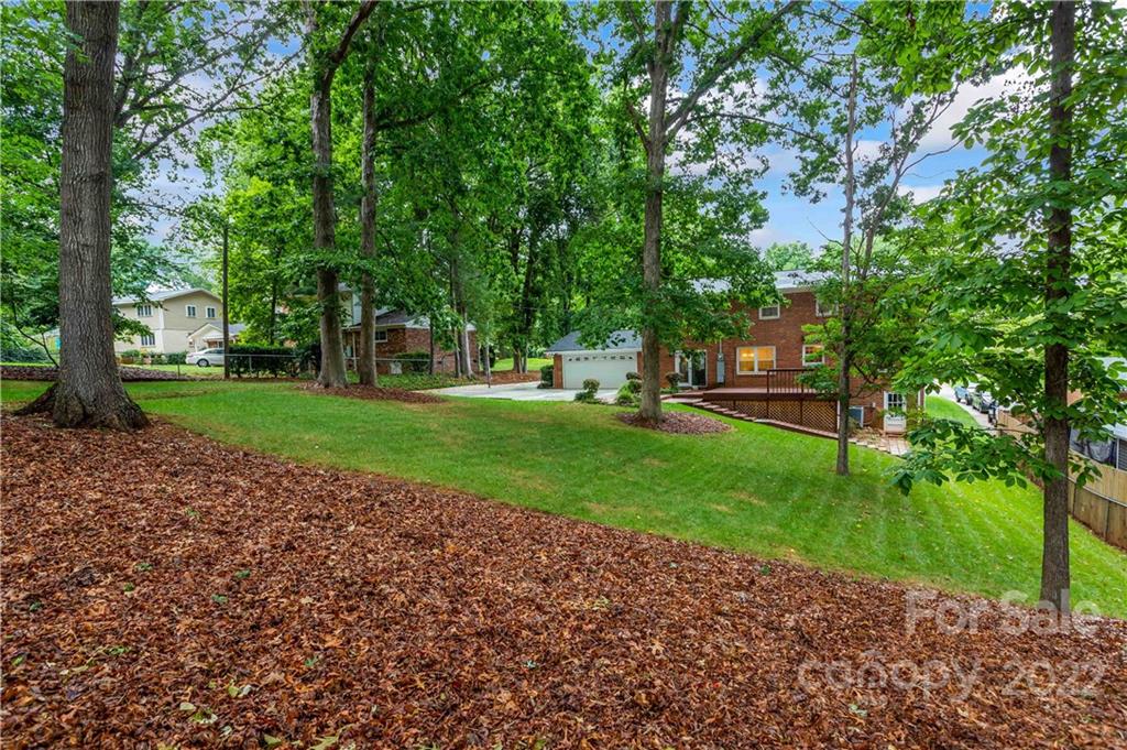 6620 Fairlawn Road Charlotte, NC 28215 - Photo 7 of 43 a view of a park with large trees