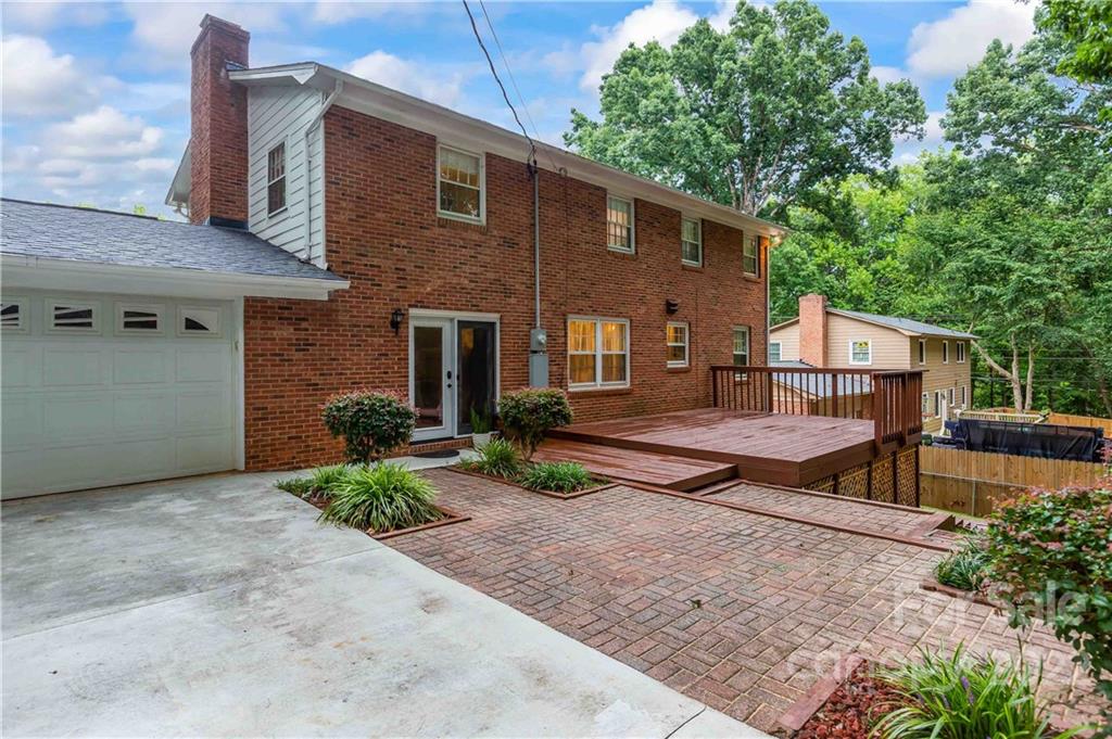 6620 Fairlawn Road Charlotte, NC 28215 - Photo 10 of 43 a view of a house with backyard and a tree