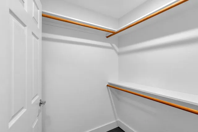 a bathroom with a window and a shower