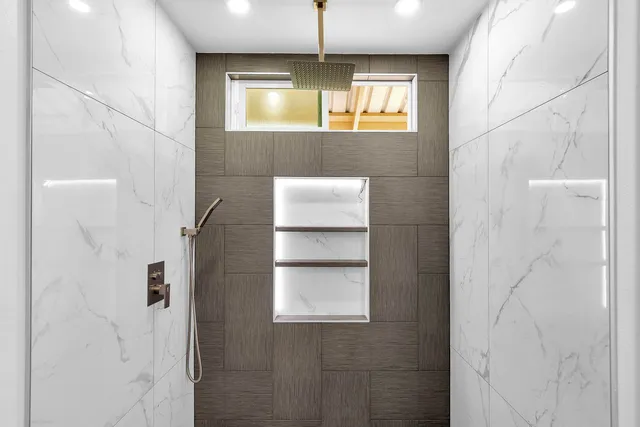 a bedroom with a bed and a potted plant