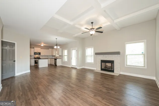 a view of an empty room and fire place