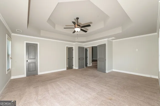 a view of a livingroom with a ceiling fan