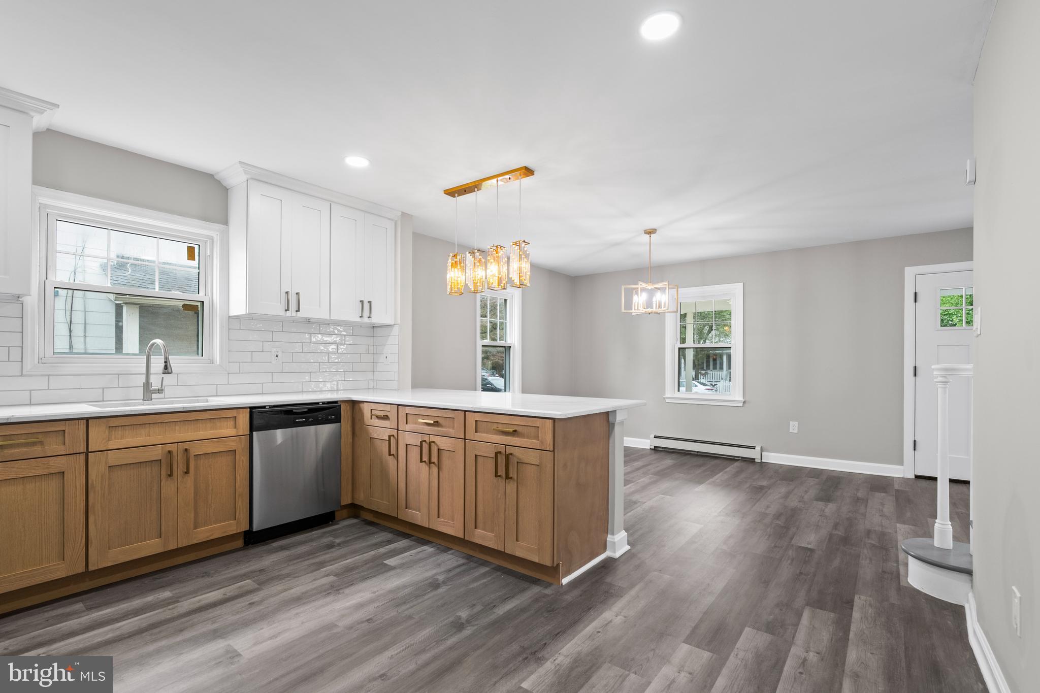 131 Lippincott Avenue Riverside, NJ 08075 - Photo 12 of 34 a large kitchen with cabinets wooden floor and stainless steel appliances