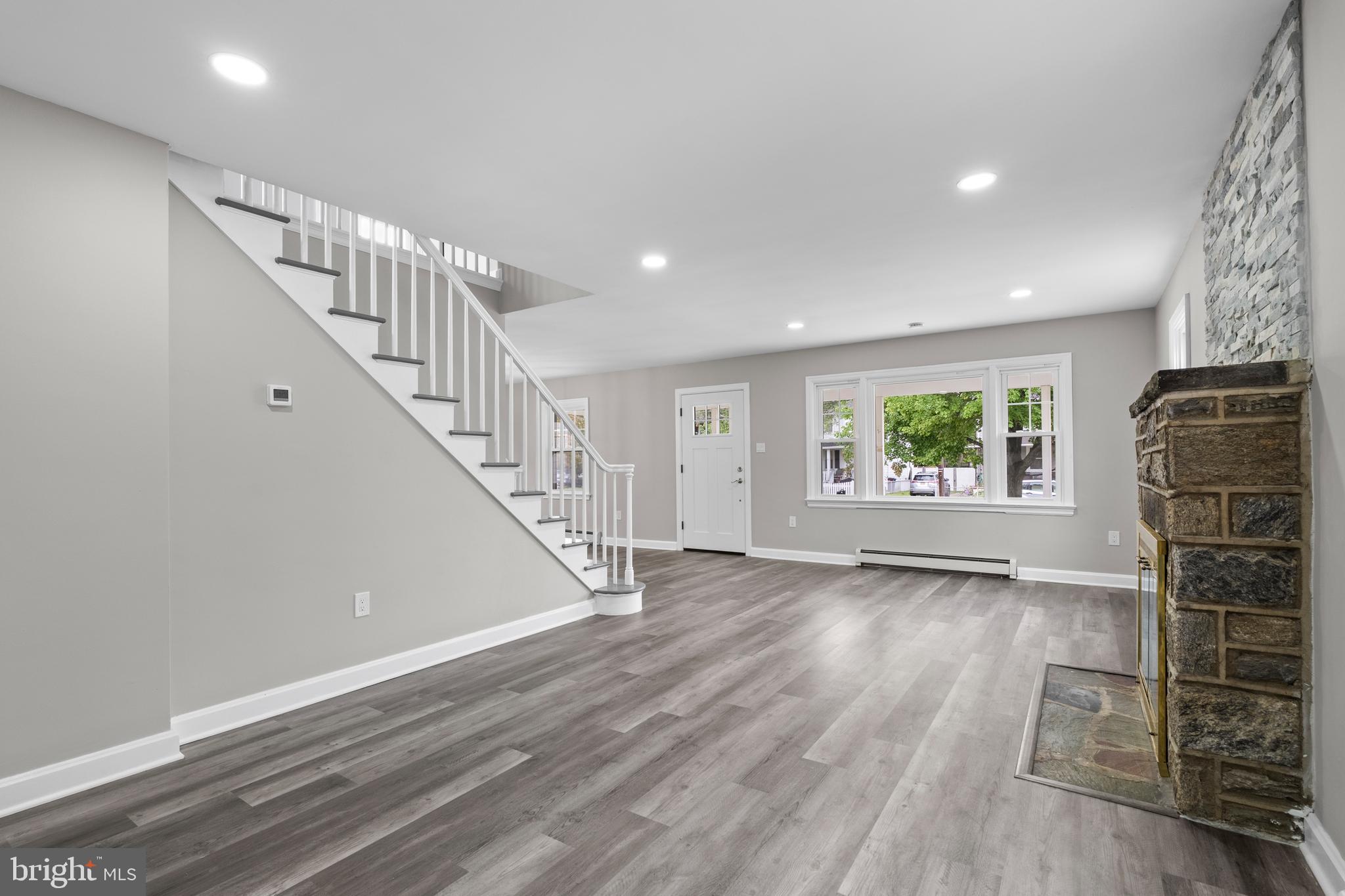 131 Lippincott Avenue Riverside, NJ 08075 - Photo 4 of 34 a view of an empty room with wooden floor and a window