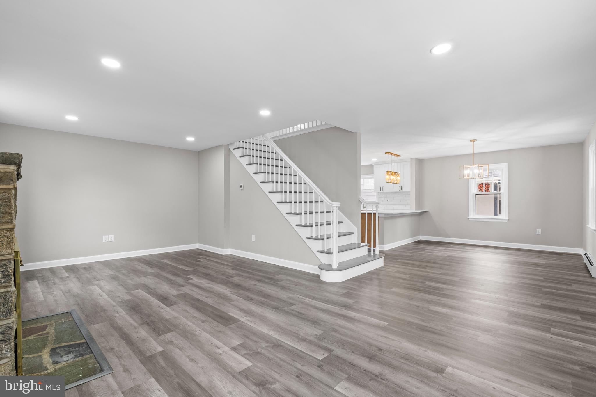 131 Lippincott Avenue Riverside, NJ 08075 - Photo 5 of 34 an empty room with wooden floor and windows