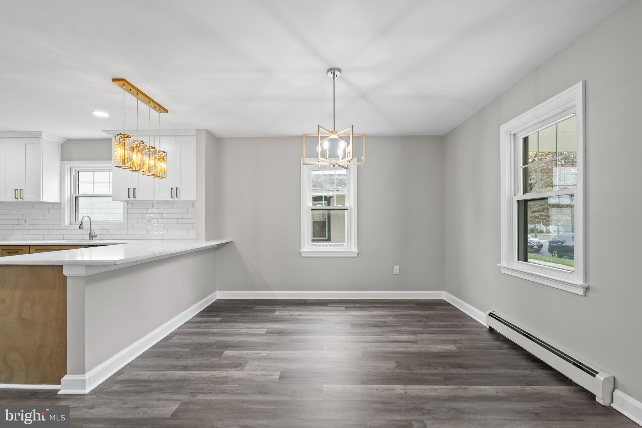 131 Lippincott Avenue Riverside, NJ 08075 - Photo 7 of 34 a bathroom with a sink windows and a mirror
