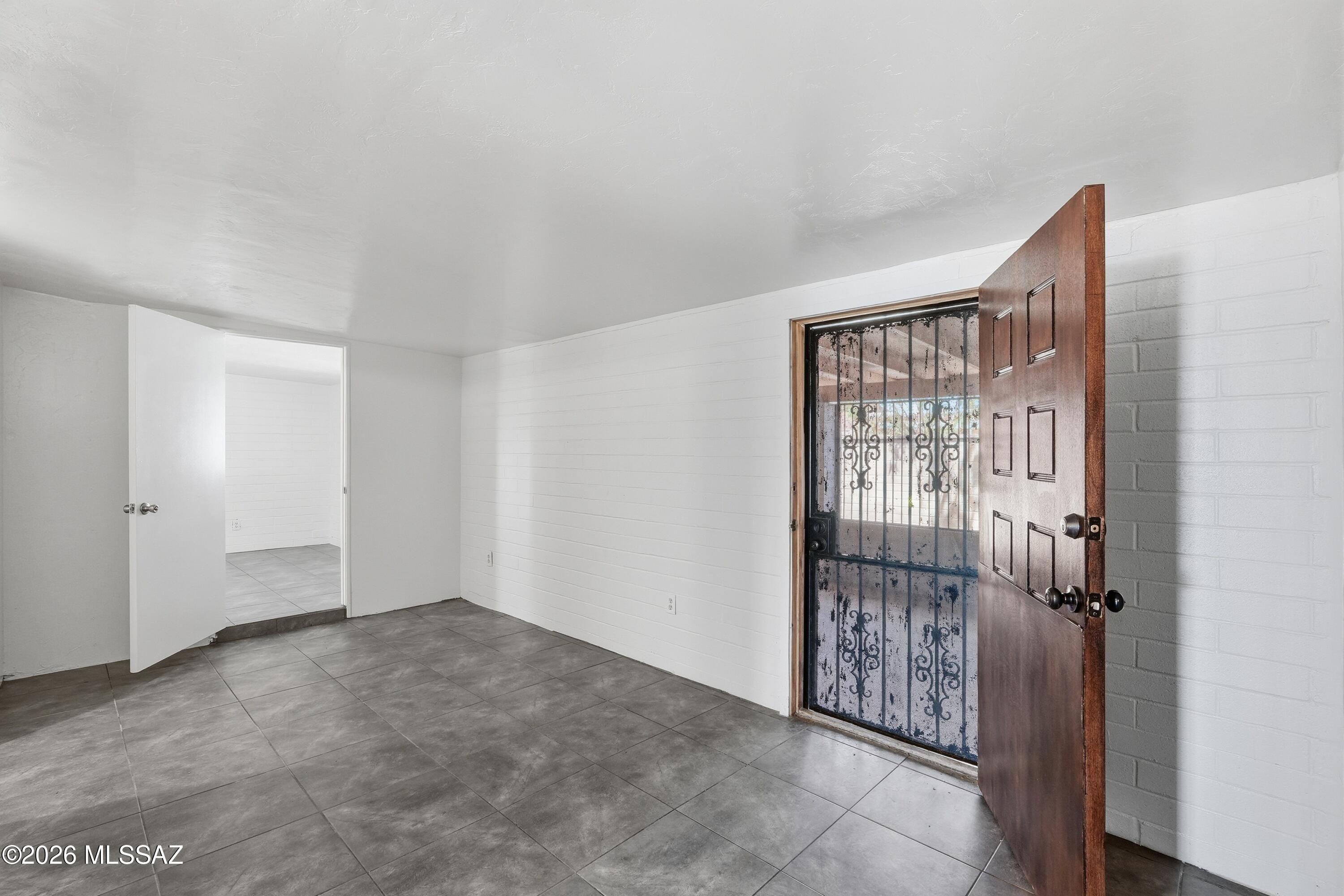 1808 West Caravelle Road Tucson, AZ 85713 - Photo 27 of 38 a view of an empty room with glass door