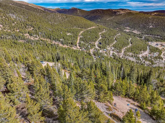a view of a field with an ocean