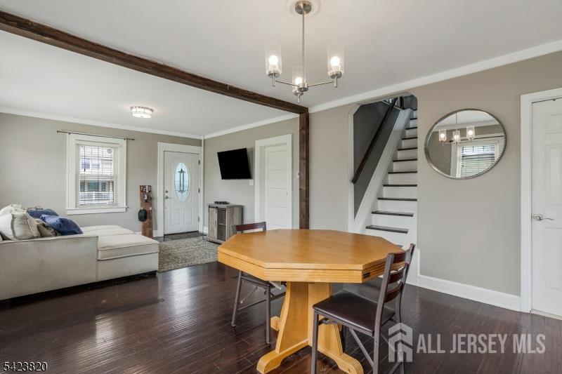 110 Parker Street Middlesex, NJ 08846 - Photo 3 of 25 a view of a dining room with furniture wooden floor and chandelier