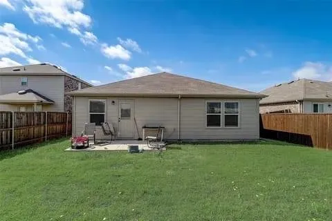a front view of house with yard and outdoor seating