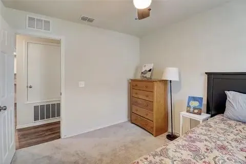 a bedroom with a bed and a view of bathroom