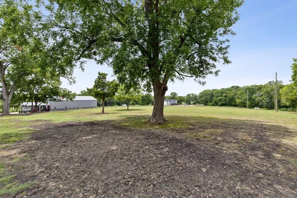 a view of a lake with a yard