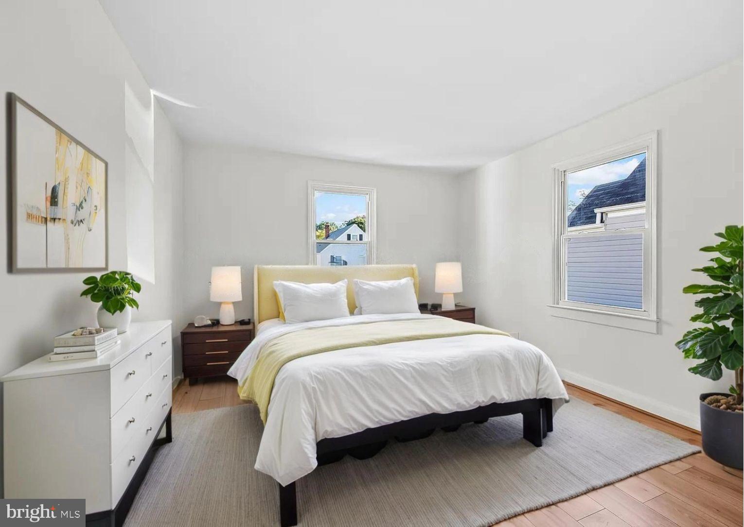 2511 Wentworth Road Baltimore, MD 21234 - Photo 11 of 24 a bedroom with a bed potted plant with the wooden floor