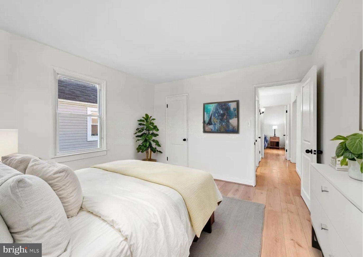 2511 Wentworth Road Baltimore, MD 21234 - Photo 12 of 24 a spacious bedroom with a bed and a couch