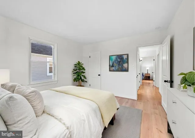 a spacious bedroom with a bed and a couch