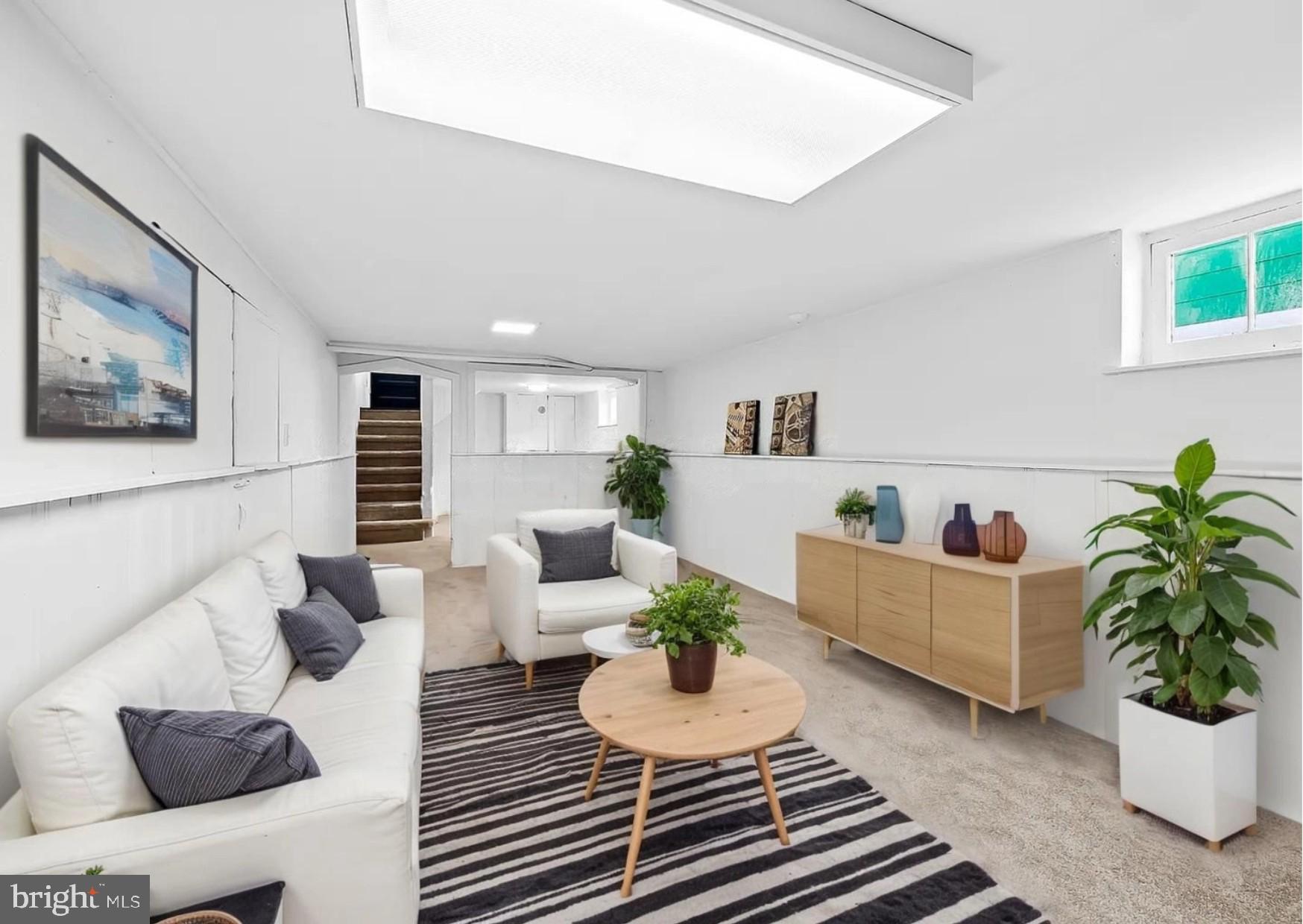 2511 Wentworth Road Baltimore, MD 21234 - Photo 21 of 24 a living room with furniture and a potted plant