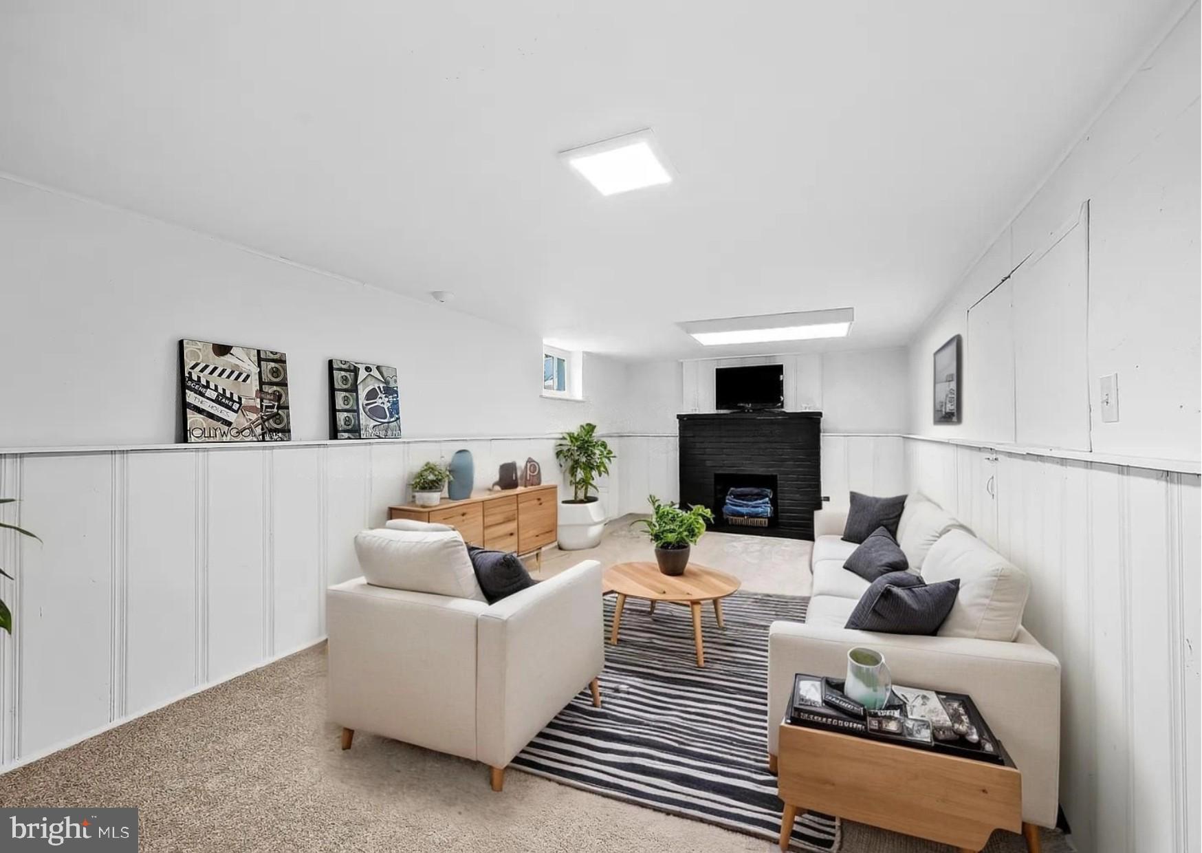 2511 Wentworth Road Baltimore, MD 21234 - Photo 22 of 24 a living room with furniture and a fireplace
