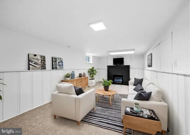 a view of an empty room with a fireplace