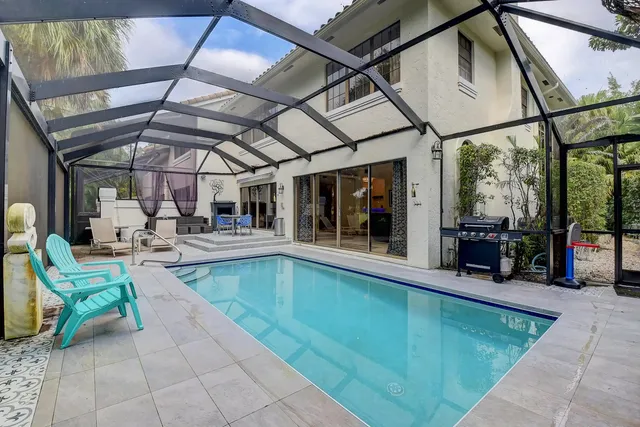 a spacious bedroom with a bed and a large window