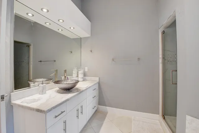 an aerial view of a house with a lake view