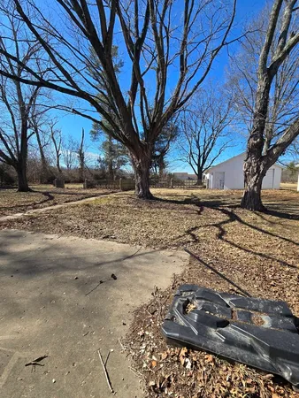 a view of a backyard of the house