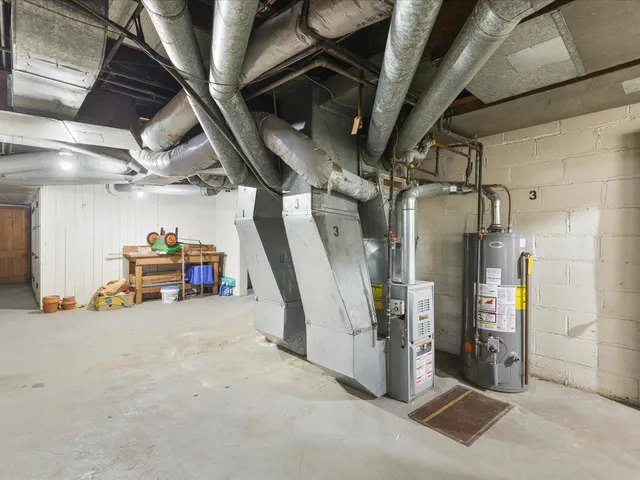 a view of a room with furniture and a chandelier