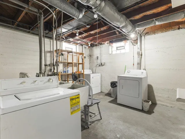 a view of a backyard with a large tree