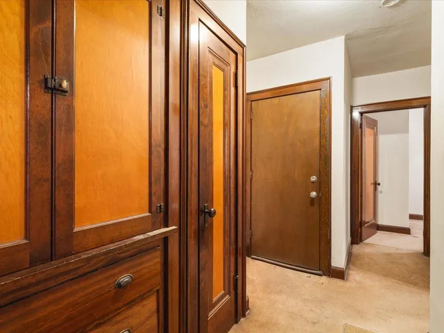 an entryway with wooden floor