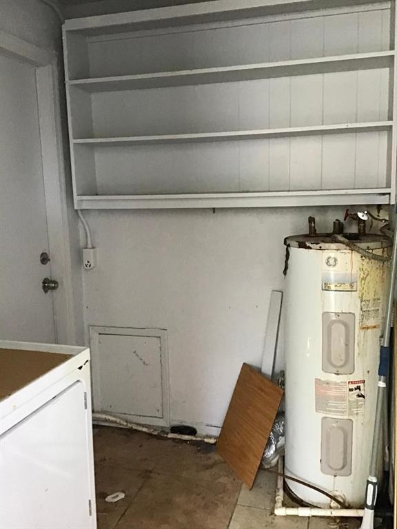 854 Derbyshire Road Daytona Beach, FL 32117 - Photo 12 of 12 a view of a storage & utility room with a washer and dryer