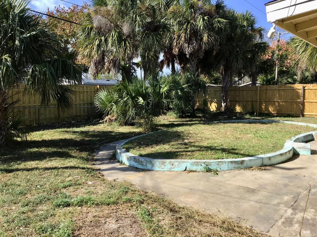 854 Derbyshire Road Daytona Beach, FL 32117 - Photo 10 of 12 a view of a park with large trees